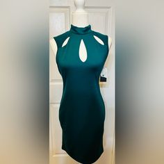 Beautiful Stunning Elegant Classy Straight Cut Sleeveless Teal Green Dress With Darling Cutouts On Top Of Dress. Slip On Dress With Two Button At Back Of Neck For Closure. Would Be Cute For A Night On The Town Wedding Or Any Event! New With Tags. Beautifully Made. 37 Inch From Shoulder To Bottom Of Hemline 9 Inches Armpit 16 Inch Across Bust 16 Inch Hips Extra Button Slight Stretch To Material Fully Lined Style Tags: Office, Career, Cut Outs, Business Casual, Simple, Neutral, Sleeveless , Staple Green Fitted Sleeveless Evening Dress, Fitted Green Sleeveless Halter Dress, Green Fitted Sleeveless Halter Dress, Green Sleeveless Knee-length Dress For Night Out, Green Stretch Sleeveless Dress For Night Out, Green Sleeveless Mini Dress For Date Night, Green Sleeveless Midi Dress For Night Out, Green Stretch Sleeveless Dress For Date Night, Green Stretch Sleeveless Dress