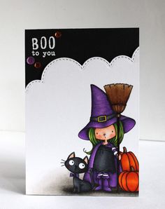 a handmade halloween card with a witch and her black cat on it's lap