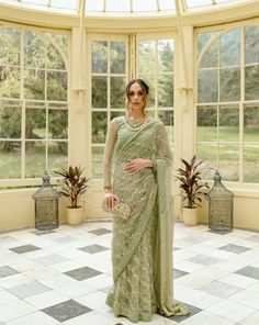 Please note the following before ordering: 3 piece suit comes with petticoat, blouse, and pre-pleated saree Blouse length: 16 inches The shirt and saree are made of net and the palloo is made of chiffon. We do not offer returns or exchanges on this item. We cannot make any exceptions to this policy. Orders cannot be changed or cancelled after 30 minutes of completion of the order. We cannot make any exceptions to this policy. Laces and buttons may vary slightly depending on availability. Color m Green Saree Set For Reception, Elegant Pista Green Set With Cutdana Detailing, Elegant Pista Green Set With Cutdana, Pista Green Blouse With Sheer Dupatta For Reception, Fitted Pre-draped Saree With Dupatta For Transitional Season, Green Palazzo Set With Unstitched Blouse For Wedding, Designer Long Sleeve Pre-draped Saree For Eid, Unstitched Pista Green Palazzo Set For Reception, Eid Pre-draped Saree With Zari Work And Long Sleeves