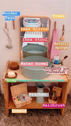 a wooden table topped with lots of bowls and pans next to a mirror on the wall