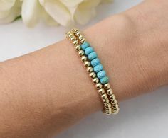 Purify your everyday with this stunning Turquoise gemstone + 14kt gold fill beaded bracelet. A perect addition to your favorite summer stack [Turquoise is a purification stone. It dispels negative energy and can be worn to protect against outside influences or pollutants in the atmosphere. Turquoise balances and aligns all the chakras, stabilizing mood swings and instilling inner calm]. Shop our matching turquoise threaders "Imagine" 5mm faceted roundelle Turquoise gemstone beads 4mm gold fill s Everyday Wear Jewelry, Day Dreaming, The Chakras, Bead Stringing, Mood Swings, Cord Bracelets, Bracelet Collection, Gold Filled Jewelry, Turquoise Gemstone