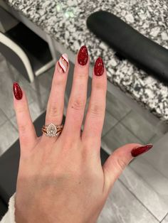 It can be anything, as long as it's holiday-themed! Christmas Gelish Nails, Candy Cane Almond Nails, Red Candy Cane Nails, Christmas Candy Cane Nails, Christmas Nails Candy Cane, Candy Cane Nails, Red Christmas Nails, Cute Christmas Nails, Christmas Nails Easy