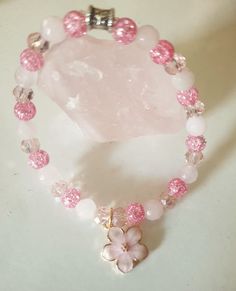 Sakura Flower Bracelet with natural Rose Quartz, cracked crystal and rondelle crystal beads.Approx. 18 cm Made with love. Matching earrings available.https://www.etsy.com/listing/1764498803/ Cherry Blossom Bracelet, Cracked Crystal, Sakura Flower, Rose Quartz Beads, Quartz Beads, Flower Bracelet, Quartz Rose, Glamour Fashion, How To Make Beads