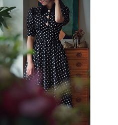 A classic polka dot dress full of elegance. This item has a noble atmosphere from the good old days, with attention to detail in the decoration. The high waist makes it look stylish, and the moderate length gives it a neat and elegant look. 
 
 
 
 
 
 
 
 
 
 Color 
 
 Black collar 
 White collar 
 
 
 Size 
 
 
 XS size 
 
 Length: 105cm 
 Shoulder width: 34.5cm 
 Bust: 80cm 
 Waist: 62cm 
 
 
 S size 
 
 Length: 109cm 
 Shoulder width: 35cm 
 Bust: 84cm 
 Waist: 66cm 
 
 M size 
 
 Length: 10 Elegant A-line Midi Dress For Vintage Fashion, Elegant Polka Dot Midi Dress For Evening, Elegant Knee-length Midi Dress For Vintage Fashion, Elegant Knee-length Midi Dress In Vintage Style, Polka Dot Midi Dress For Formal Occasions, Formal Polka Dot Midi Dress, 1950s Style Polka Dot Vintage Dress, Elegant Polka Dot Dresses With Buttons, Elegant Short Sleeve Polka Dot Midi Dress