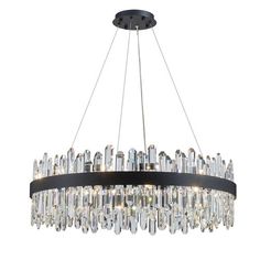 a round chandelier with crystal drops hanging from the center and black metal frame