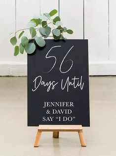 a sign that says 50 days until and is on top of a wooden easel