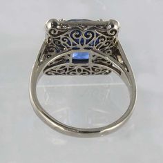 For Sale on 1stDibs - 18K white gold ring, eagle's head hallmark. This splendid rectangular shaped sapphire and white gold ring boasts a cushion cut Ceylan Blue sapphire held Art Deco Platinum Sapphire Ring, Art Deco Platinum Sapphire Ring With 17 Jewels, Luxury White Gold Sapphire Ring Collectible, Fine Jewelry Platinum Cushion Cut Sapphire Ring, Platinum Emerald Cut Ring With 17 Jewels, White Gold Sapphire Ring With Cushion Cut Diamond, Antique Platinum Gemstone Rings, Antique Platinum Ring With Gemstone, Antique Platinum Rings With Gemstone