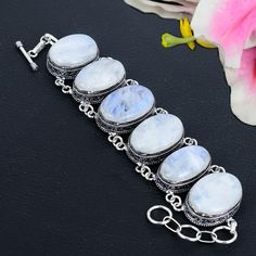 White Rainbow Moonstone Gemstone Bracelet Handmade 925 Sterling Silver Bracelet Adjustable Moonstone Cabochon Gemstone Jewelry Gift For Her SKU - KG- 1320 Handmade - Bracelet Gemstone - Moonstone  Stone Shape - oval Metal Purity - 925 Sterling Silver Bracelet Length -  7 Inches To 8 Inches With Adjustable Chain   Ornazjewels is committed to delivering the best quality sterling silver jewelry to customers. As a handmade jewelry manufacturer, we offer an extensive selection of silver gemstone jewe Silver Moonstone Round Crystal Bracelet, Silver Round Moonstone Crystal Bracelet, Silver Moonstone Crystal Bracelet, Sterling Silver Bracelet With Gemstone And Moonstone, Bohemian Silver Moonstone Crystal Bracelet, Moon Shaped White Bracelets For Gifts, White Moon Shaped Bracelets For Gift, White Moon-shaped Bracelets For Gifts, Moon Shaped White Bracelet For Gift