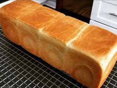 a loaf of bread sitting on top of a cooling rack