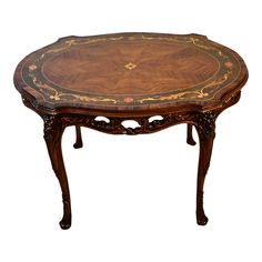 an ornately decorated wooden table on white background