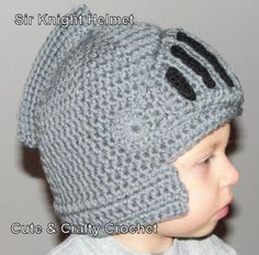 a little boy wearing a knitted hat with ears