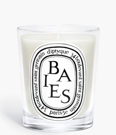 a candle that is sitting in front of a white background with the words paes on it