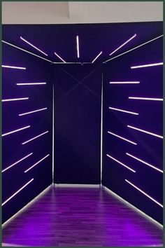 an empty room with purple lighting in it