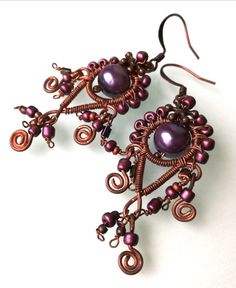 Cute, elegant bohemian wire wrapped earrings made with copper wire and purple glass beads. Handmade, bohemian earrings made with copper wire. Chandelier earrings wire wrapped. Wrapped Hoop Earrings. Unique and oneofakind wirewrapped earrings. Onepiece. Elegant boho earrings. Oneofakind earrings. The copper and purple combination goes with many outfits. Timeless earrings are suitable with daily or evening clothing combinations. Gift idea. Onepiece. Every jewel are handmade and unique, All my item Bohemian Hand Wrapped Dangle Earrings, Bohemian Hand-wrapped Dangle Earrings, Bohemian Wire Wrapped Wrap Earrings Gift, Bohemian Wire Wrapped Adjustable Wrap Earrings, Bohemian Adjustable Wire Wrapped Wrap Earrings, Bohemian Purple Wire Wrapped Jewelry, Bohemian Purple Droplet Chandelier Earrings, Purple Bohemian Chandelier Earrings, Bohemian Purple Chandelier Earrings