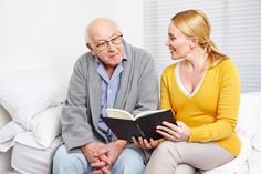 Woman reading book to senior man. Woman reading a book to a senior citizen men i , #SPONSORED, #book, #senior, #Woman, #reading, #man #ad Elderly Caregiver, Home Care Agency, Books To Read For Women, Parenting Plan, Elder Care, Family Caregiver, Senior Home Care, The Finger Lakes, Vision Problems