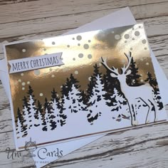 a christmas card with an image of a deer in the woods