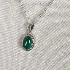 Silver Malachite Gemstone Necklace, Elegant Silver Malachite Jewelry, Green Sterling Silver Oval Pendant Jewelry, Oval Malachite Necklace As Gift, Green Sterling Silver Jewelry With Oval Pendant, Green Oval Pendant Jewelry In Sterling Silver, Silver Malachite Necklace With Natural Stones, Oval Malachite Gemstone Jewelry, Malachite Gemstone Jewelry For May Birthstone