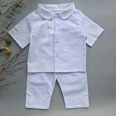 Nice Christening White Fine Cotton Baby Boy Suit decorated with cotton lace.  Made from soft pure cotton fabric. It looks very nice and glitters elegantly.  The personalization embroidery could be on a shirt sleeve, collar or bottom side, as well as on the sole of the booties. - 100% Fine Pure Cotton  - White Color Size Chart for child's height: Suit Preemie           50 - 56 cm    19.68 - 22.04 inches  Newborn          56 - 62 cm     22.04 - 24.40 inches 0-3 months      62 - 68 cm     24.40 - 26.77 inches 3-6 months      68 - 74 cm     26.77 - 29.13 inches 6-9 months      74 - 80 cm     29.13 - 31.49 inches 9-12 months     80 - 86 cm     31.49 - 33.85 inches 12-18 months   86 - 92 cm     33.85 - 36.22 inches 18-24 months   92 - 98 cm     36.22 - 38.58 inches 2-3 years      98-104 cm Cotton Sets With Lace Trim And Short Sleeves, Cotton Lace Trim Sets With Short Sleeves, Cotton Wedding Sets With Lace Trim, White Cotton Baptism Dress For Summer, Cotton Short Sleeve Sets With Lace Trim, White Sets For Baptism In Spring, White Embroidered Baptism Dress For Summer, Wedding Sets With Lace Trim In Cotton, Spring Baptism Short Sleeve Sets