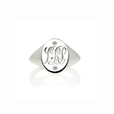 This initial and diamonds signet ring is a beauty – hand engraved in a classic interwoven script font, with 2 or 3 initials of your choice by our master engraver here in Hatton Garden, and set with 2 diamonds to give it some extra sparkle – under-stated elegance with a vintage, personalised feel.  This monogram ring would make a fabulous gift for a special occasion.The sleek design has an androgynous quality to it so it’s suitable for men and women. Effortlessly stylish, looks great worn as a pi Classic Diamond Monogram Rings, Classic Monogram Diamond Rings, Classic White Engraved Initial Ring, Elegant White Initial Ring Engraved, Elegant White Initial Ring With Engraving, Elegant White Engraved Initial Ring, Personalized Silver Diamond Signet Ring, Classic White Personalized Rings, Classic White Ring With Initials