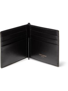 Neat and streamlined, SAINT LAURENT's wallet slips easily into a back pocket or briefcase. It's made from smooth black leather appliquéd with the house's logo; inside, it has six handy card slots and a money clip. Designer Business Wallets With Interior Card Slots, Classic Rectangular Wallet With Flat Pocket, Black Formal Card Holder With Coin Pocket, Classic Rectangular Wallets For Business, Designer Bifold Business Wallet, Classic Rectangular Business Wallets, Designer Bifold Card Holder For Business, Designer Bifold Business Card Holder, Classic Black Card Holder For Formal Use