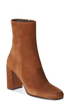 This Italian-made suede bootie is perched on a logo-gilded demi-block heel that brings a modern feel to the classic style. 3 1/4" (85mm) heel Side zip closure Leather upper and lining/rubber and leather sole Made in Italy Designer Shoes Designer Suede Heeled Boots For Fall, Elegant High Ankle Suede Boots, Luxury Suede Heeled Boots For Formal Occasions, Designer Suede Heeled Boots For Formal Occasions, Designer Suede Heeled Boots For Formal Events, Luxury Suede Boots With Sculpted Heel, Modern High Ankle Suede Heeled Boots, Luxury Suede Boots With Reinforced Heel, Suede Boots With Branded Heel Counter For Work