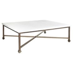 a white table sitting on top of a metal frame