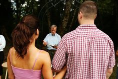 a group of people standing around each other