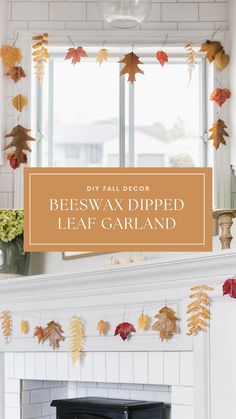 a fireplace with fall leaves hanging from it and the words beeswax dipped leaf garland