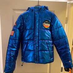 Rare Champion X Nasa Metallic Blue Puffer Space Jacket New With Tags! Originally $250 Champion Hoodie Women, Nasa Jacket, Pink Champion Hoodie, Pink Puffer Jacket, Champion Pullover, Champion Jacket, Black Windbreaker, Blue Puffer, Cropped Crewneck