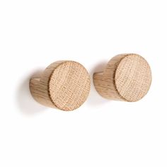 two wooden knobs on a white background