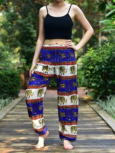 These beautifully crafted trousers are hand made in Thailand. They are constructed from 100% Super Soft Rayon material, that is both lightweight but strong & resilient.This style comes in 1 size currently (Small / Medium) with a fully elasticated waist.Our harem pants will make you feel like you're walking on air because they are constructed from lightweight, supersoft and breathable 100% Thai Rayon.Features include:-• 1 x External pocket on right hip• Elasticated smocked waist• Elasticated Dashiki Shirt Mens, Womens Harem Pants, Kids Harem Pants, Maternity Trousers, Cotton Harem Pants, Flatten Tummy, Dashiki Shirt, Elephant Pants, Harem Shorts