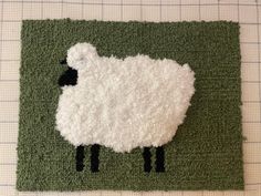 there is a sheep rug on the floor that looks like it has been crocheted