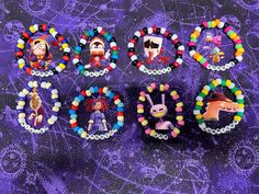 six beaded bracelets with cartoon characters on them