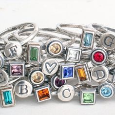 "How fun is it to make your own ring using the initials and birthstones of those you love?! Unleash the inner jewelry designer and pick from all of our hand crafted silver bands and birthstone rings to build a family ring or mother's ring you will cherish forever. Also available in gold bands at this listing: https://www.etsy.com/listing/825827495 ♥♥ HOW TO ORDER ♥♥- 1. CHOOSE YOUR SIZE 2. CHOOSE YOUR COMBINATION 3. IN THE COMMENTS SECTION AT CHECKOUT PLEASE INCLUDE: a. WHAT INITIALS AND/OR SYMB Mothers Ring Stackable, October Jewelry, Initial Rings, April Birthstone Ring, Stackable Birthstone Rings, Mother's Ring, Stack Rings, Stackable Ring Sets, Design Your Own Ring