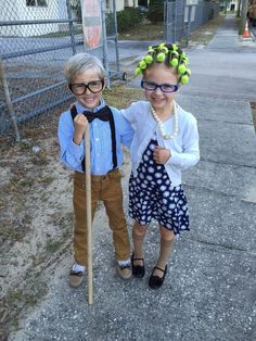 two young children dressed up in costumes