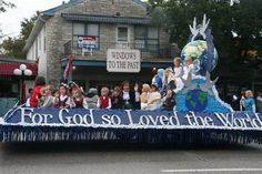 a parade float with people riding on it