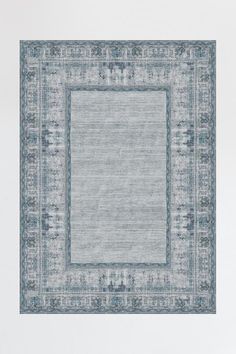 a blue rug with an ornate border