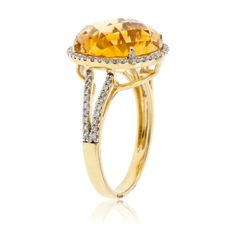 14K Yellow Gold .22ctw Diamond Halo and 8.80ctw Citrine Ring Product Details: The fancy millennial cut of this 8.80 carat citrine allows the gemstone to reflect and refract with beautiful and shimmering honey-colored light to dark hues. The rare and precise cut of this gemstone was designed by the world renowned gem-cutters in Idar-Oberstein, Germany to display intense color shimmering throughout the stone while reflecting stunning shades of golden yellow. Sparkling diamonds are demi-pave set to Sapphire Diamond Necklace, Halo Necklace, Citrine Pendant, Diamond Halo Ring, Sparkling Rings, Orange Sapphire, Detailed Ring, Sapphire Diamond Ring, Citrine Ring