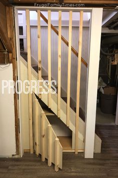 the stairs are being built into the wall in this room with wood flooring and white walls