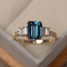 This ring features a 7*9 mm emerald cut london blue topaz. Customization is available. It is made by hand, and it will take about 7 days to finish the ring after your payment is completed. Main stone: 7*9 mm emerald cut london blue topaz Main stone weight: 3.26 ct Metal type: sterling silver /14k gold Accent stone: cz Customization is available, just fee free to contact me, it is free to engrave inside the ring, it is free, you can leave a ntoe with your order, but it will be great no more than Emerald Cut Topaz Ring With Sapphire Accent Stones, Emerald-cut Sapphire Ring With Topaz Accent Stones, Blue Emerald-cut Topaz Ring In 14k Gold, Blue Emerald Cut Topaz Ring In 14k Gold, 14k Gold Emerald Cut Topaz Ring, Topaz Ring Yellow, Blue Topaz Ring Gold, Yellow Topaz Ring, Silver Halo Ring