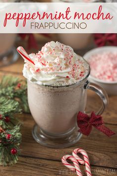 peppermint mocha frappuccino in a mug with candy canes