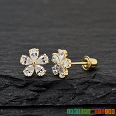 Daisy Flower Stud Earrings with Clear Cubic Zirconia 14K Yellow Gold Stud Screw Back Earrings  *Note: This listing is for One Pair of Stud earrings Metal: Solid 14K Yellow Gold Metal Stamp: 14K Finish: Polished Size: 6.7mm x 6.7mm Stone Size : 4mm x 1mm Gem Type: High-Quality Grade AAA CZ (Cubic Zirconia) Gem Shape: Oval Gem Color: Clear CZ Setting: Casting Prong Setting Backing: Screw Back/ Safety Back *Nickel FREE* Please Select CZ Size of Earrings  Perfect for Toddler, Baby, Babies, Kids, Chi Flower Earrings Studs, Flower Studs, Everyday Earrings, Cute Woman, Screw Back Earrings, Rose Gold Engagement Ring, Gold Studs, Elegant Earrings, Daisy Flower