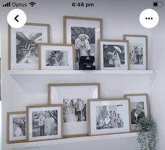 a wall with pictures and frames on it