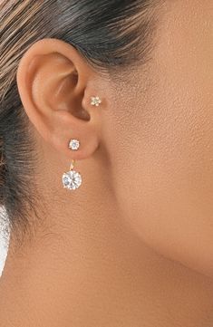 These sparkling brilliant CZ stud jacket earrings curve around the ear for chic, contemporary style. 1" drop 4mm CZ stone, 8mm jacket Post back Lead and nickel free 14K rose gold plated sterling silver/cubic zirconia, 14K yellow gold plated sterling silver/cubic zirconia, or sterling silver/cubic zirconia Imported Classic Cubic Zirconia Piercings, Elegant Piercings With Diamond Accents, Elegant Formal Piercings, Jacket Earrings, Studded Jacket, Earring Jackets, Fancy Earrings, Earrings In Gold, Cz Stone