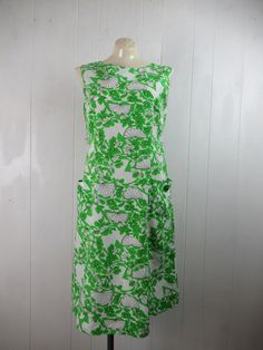 "Vintage 1960s sundress. Made of green, black and white cotton. Has all over floral print with stylized lime wedges. Back zipper and two pockets. Made by Shaker Square. About a size medium. Actual measurements are: 37.5\" around the bust 34\" around the waist 38\" around the hips 40\" overall length In very good condition with a 1/8\" spot on the back." Wedge Dress, Beauty Forever, 1970s Dresses, 1960's Dress, Lime Wedge, Hawaiian Dress, Vintage Hawaiian, Mod Dress, Dress Cotton