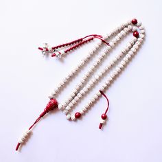 This Mala is made of Natural White Moon and Star Bodhi Seeds, with 90% Purple Cinnabar Spacer Beads, 97% Purple Cinnabar Guru Bead and Mala Counters. M A L A ♡ This mala is about 27 inches (6mm beads) in length, with another 2 inches adjustable length at the bottom of the guru bead.  ♡ The 2 strands of mala counters and bhum counter are attached to the mala. You can change the position by loosing the adjustable knots and sliding them over the beads.   M A L A   B A G ♡ An anti-oxidation bag is i Hand-strung White Mala With Round Beads, White Spiritual Mala With Round Beads, Adjustable White Mala With 8mm Beads, White Beaded Spiritual Mala, White Spiritual Mala With 8mm Beads, White Hand-strung Mala With Round Beads, Handmade White Spiritual Mala, Hand-strung White Jewelry For Puja, White Hand-strung Jewelry For Puja