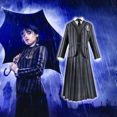 a woman holding an umbrella and standing in the rain wearing a long black dress with stripes