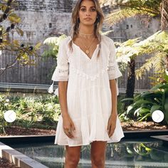 This Is An Xs But Could Fit A Small Too. Flowy White Bohemian Dress. I Bought This To Wear On Vacation But Ended Up Getting Something Else. This Dress Is Brand New And Never Worn. I Can’t Return It Because Its An Australian Company. Feminine V-neck Boho Dress For Beach, V-neck Lace Trim Dress For Vacation, V-neck Vacation Dress With Lace Trim, Bohemian Ruffle Mini Dress For Beach, Bohemian Ruffles Mini Dress For Beach Cover-up, Feminine V-neck Boho Dress For Brunch, Feminine Boho Dress For Summer Brunch, Feminine Summer Boho Dress For Brunch, Fitted Boho Dress With Short Sleeves For Day Out