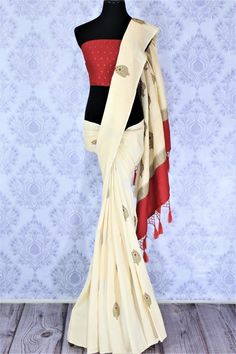 Embrace the uniqueness of this sartorial cream embroidered muga banarsi silk saree. Drape this traditional white and red Indian silk sari to weddings and festivities with a striking red buta work blouse. Shop designer silk sarees, ikkat saris, printed sarees online or visit Pure Elegance store, USA. Banarsi Silk Saree, Elegance Fashion, Red Indian, Indian Designer Sarees, Designer Silk Sarees, Pure Elegance, Designer Sarees Online, Buy Sarees Online, Ethnic Outfits