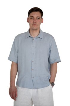 Stay cool and effortlessly stylish in our Sky Blue Linen Shirt, the perfect addition to your summer wardrobe. Crafted from breathable natural linen, this shirt offers unmatched comfort and a relaxed fit for an effortless look that's perfect for any occasion. Why Choose Our Linen Shirt? * Breathable Comfort: Linen's natural fibers allow air to circulate, keeping you cool and dry even in the hottest weather. * Relaxed Fit: The loose silhouette drapes beautifully and provides a comfortable, non-restrictive feel. * Unique Details: The spread collar adds a touch of sophistication, while the coconut shell buttons offer a natural, earthy accent. * Versatile Style: Dress it up with chinos or linen pants for a polished look, or pair it with shorts and sandals for a casual, beach-ready vibe. * Susta Blue Linen Short Sleeve Camp Shirt, Blue Linen Camp Shirt With Relaxed Fit, Blue Relaxed Fit Linen Camp Shirt, Blue Linen Camp Shirt For Spring, Blue Linen Camp Shirt For Vacation, Casual Blue Linen Camp Shirt, Casual Light Blue Linen Tops, Light Blue Linen Short Sleeve Top, Light Blue Linen Casual Tops